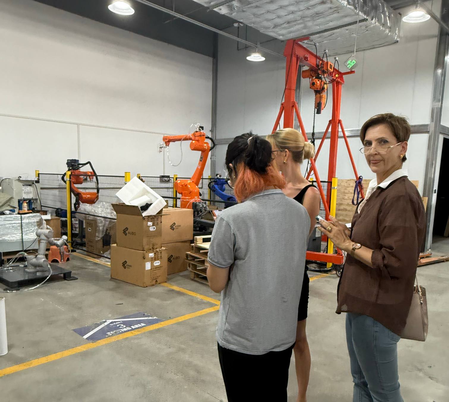 Azerbaijani customer visiting the industrial robot area at SZGH on October 23, 2026