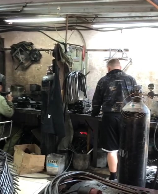 Manual welding workshop at Russian metal chair frame manufacturer before robot automation.jpg